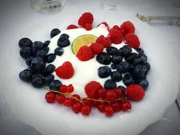 High angle view of strawberries in plate