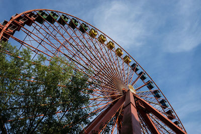 Low angle view of ferris wheel against sky