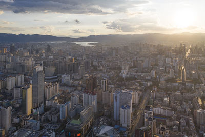 High angle view of modern buildings in city against sky