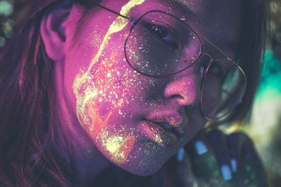 Close-up portrait of woman wearing sunglasses