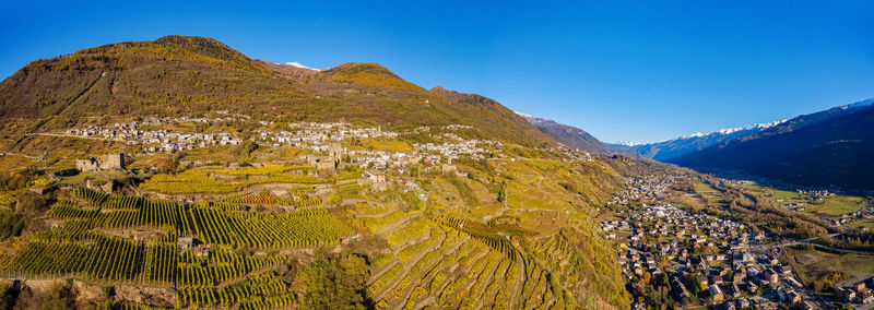 Scenic view of mountains against clear blue sky