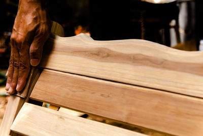 Close-up of hand working on wood