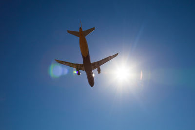 Low angle view of airplane flying in sky