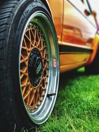Close-up of vintage car on field