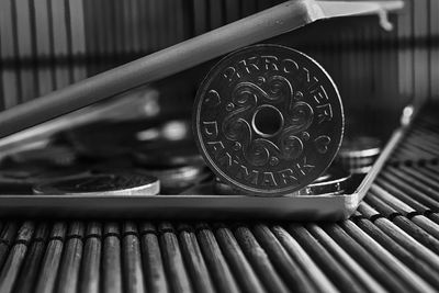 Close-up of coin in briefcase on table