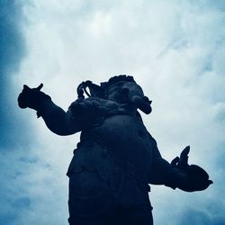 Low angle view of statue against sky