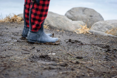 Low section of man standing on ground