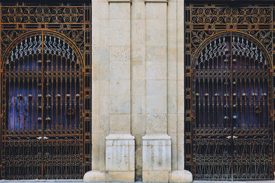 Closed metal gate of old building