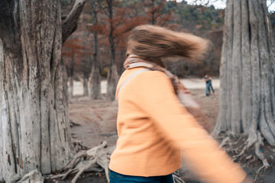 Side view of woman in forest