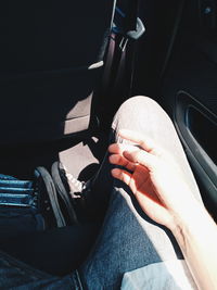 Midsection of man sitting in car