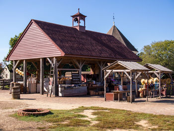 Market in colonial williamsburg, virginia, on a sunny day with clear, blue sky.