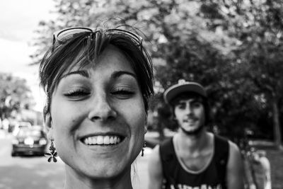 Close-up portrait of a smiling young couple