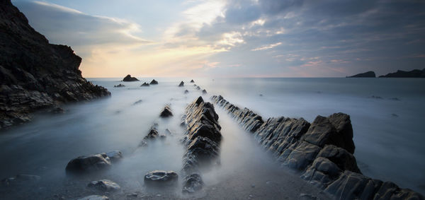 Scenic view of sea against sky during sunset