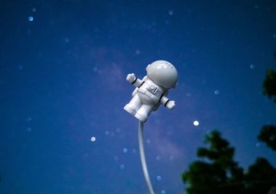 Low angle view of street light against blue sky