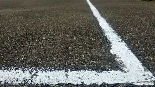 Close-up of white line on road