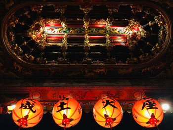 Illuminated lanterns in temple