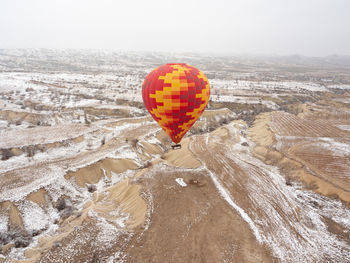 Hot air balloon flying over land