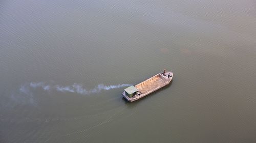 High angle view of ship sailing on sea