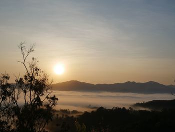 Scenic view of silhouette mountains against sky during sunset