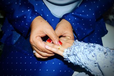 Close-up of woman holding hands