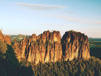 Morning sunlight on rocky towers of schrammsteine in national park saxony switzerland, germany. 