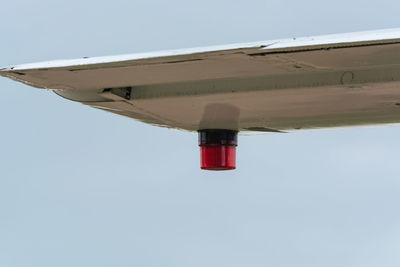 Low angle view of airplane against clear sky