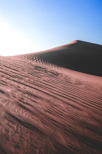 Scenic view of desert against clear sky