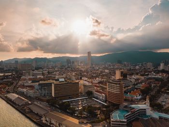 High angle view of buildings against sky during sunset