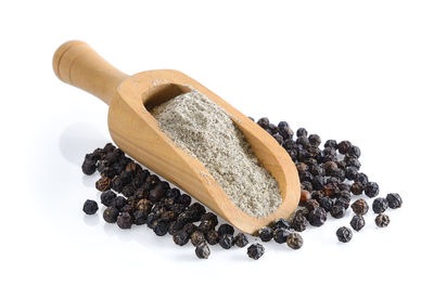 Close-up of coffee beans against white background