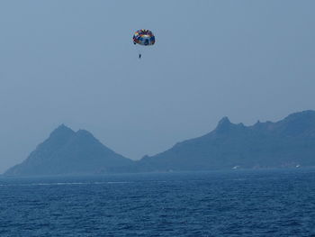 Scenic view of sea with mountains in background