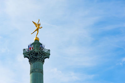 Low angle view of statue against sky