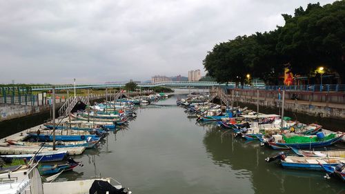 Boats moored at harbor