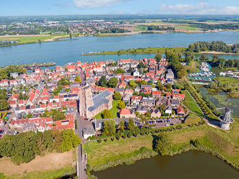 Aerial from the historical city woudrichem at the river merwede in the netherlands