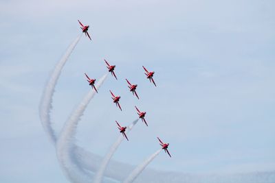 Low angle view of airplane flying in sky