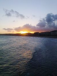 Scenic view of sea against sky at sunset