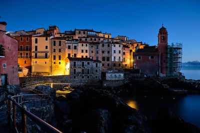 Buildings in city at dusk