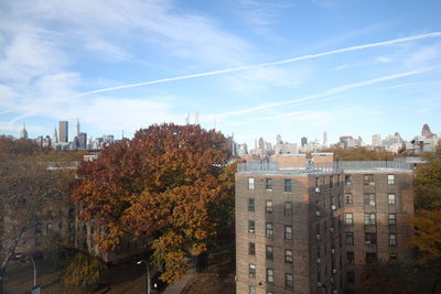 Buildings against sky during autumn