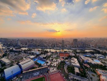 High angle view of buildings against sky during sunset