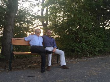 Portrait of young couple sitting in park