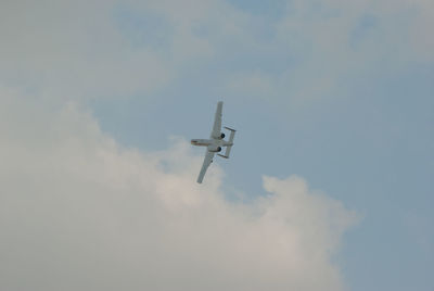 Low angle view of airplane against sky