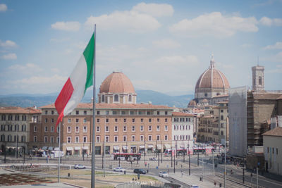 Panoramic view of buildings in city against sky