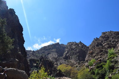 Low angle view of rocks against sky