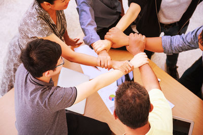 High angle view of people with hands