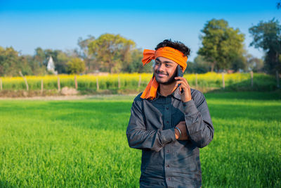 Young man standing on field