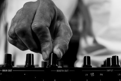 Close-up of man playing piano