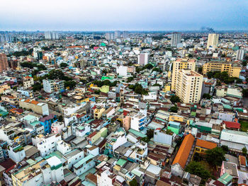 High angle view of city buildings against sky