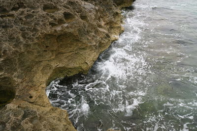 Close-up of rock formation in sea