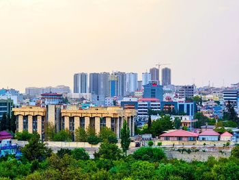 High angle view of buildings against clear sky