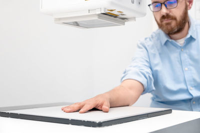 Portrait of doctor working on table