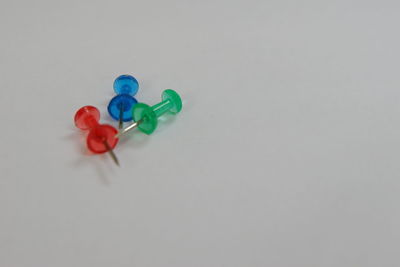 High angle view of multi colored toy on white background